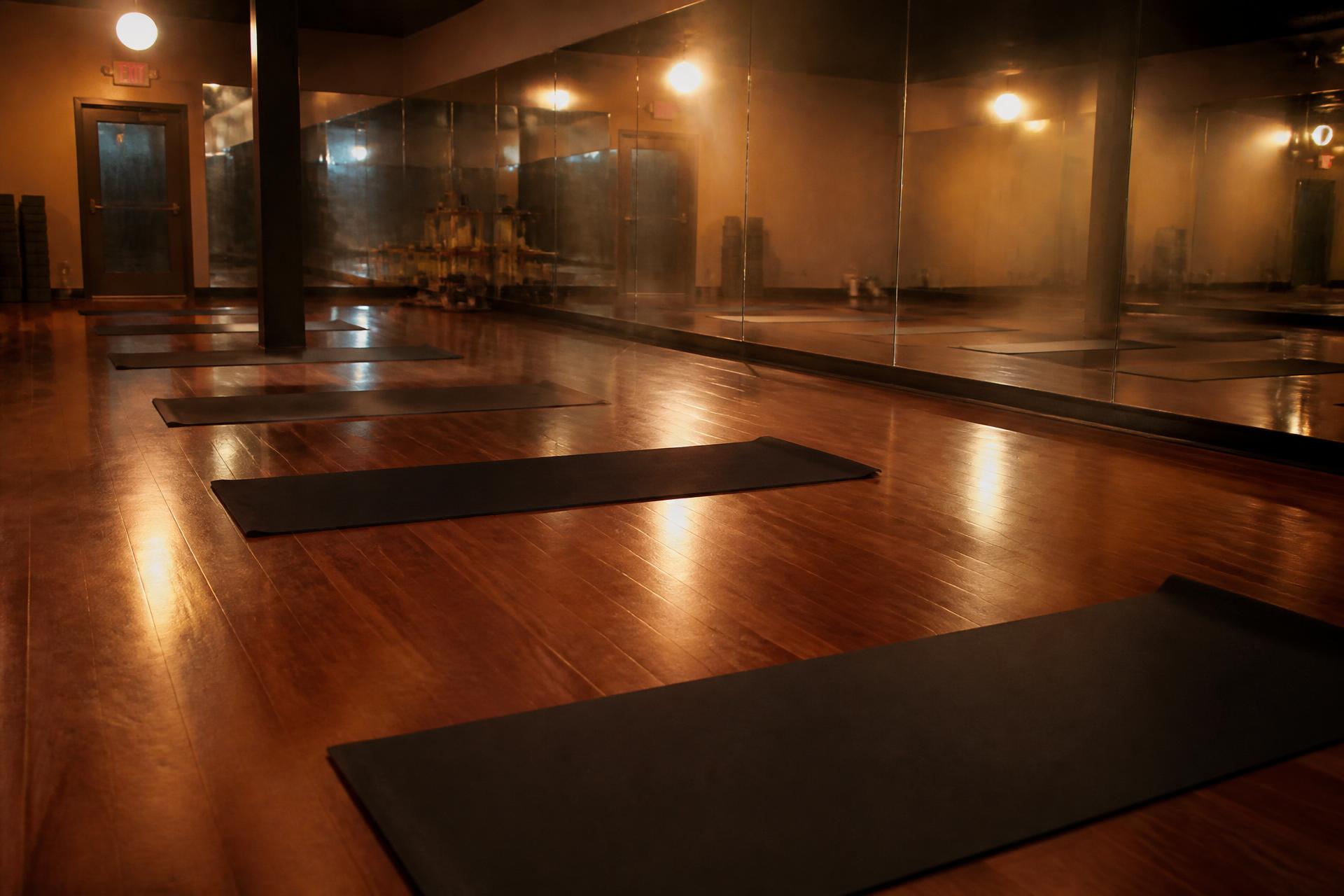 Heated yoga studio with warm ambient lighting